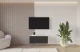 Material: Holzwerkstoff, Material der Rückwand: MDF, Ausführung: Hängend, Größe: 100 cm, Farbe: Weiß und Schwarz, Zimmer: Wohnzimmer, Anzahl der Türen: 2, Front-Typ: Gefräste, Art der Griffe: Griffleiste, Art der Türen: Klapptür, Breite: 100 cm, Tiefe: 40 cm, Höhe: 40 cm, Geschlossene Fächer: 4, Anzahl der Teile: 1 - 1