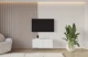 Material: Holzwerkstoff, Material der Rückwand: MDF, Ausführung: Hängend, Größe: 100 cm, Farbe: Weiß, Zimmer: Wohnzimmer, Anzahl der Türen: 2, Front-Typ: Gefräste, Art der Griffe: Griffleiste, Art der Türen: Klapptür, Breite: 100 cm, Tiefe: 40 cm, Höhe: 40 cm, Geschlossene Fächer: 4, Anzahl der Teile: 1 - 1