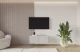 Material: Holzwerkstoff, Material der Rückwand: MDF, Ausführung: Hängend, Größe: 100 cm, Farbe: Kaschmir, Zimmer: Wohnzimmer, Anzahl der Türen: 2, Front-Typ: Gefräste, Art der Griffe: Griffleiste, Art der Türen: Klapptür, Breite: 100 cm, Tiefe: 40 cm, Höhe: 40 cm, Geschlossene Fächer: 4, Anzahl der Teile: 1 - 1
