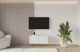Material: Holzwerkstoff, Material der Rückwand: MDF, Ausführung: Hängend, Größe: 100 cm, Farbe: Weiß, Zimmer: Wohnzimmer, Anzahl der Türen: 2, Front-Typ: Gefräste, Art der Griffe: Griffleiste, Art der Türen: Klapptür, Breite: 100 cm, Tiefe: 40 cm, Höhe: 40 cm, Geschlossene Fächer: 4, Anzahl der Teile: 1 - 1