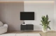 Material: Holzwerkstoff, Material der Rückwand: MDF, Ausführung: Hängend, Größe: 100 cm, Farbe: Schwarz, Zimmer: Wohnzimmer, Anzahl der Türen: 2, Front-Typ: Gefräste, Art der Griffe: Griffleiste, Art der Türen: Klapptür, Breite: 100 cm, Tiefe: 40 cm, Höhe: 40 cm, Geschlossene Fächer: 4, Anzahl der Teile: 1 - 1